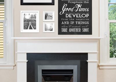 Croft Fireplace insert with clean white mantel and gallery wall in transitional family room.