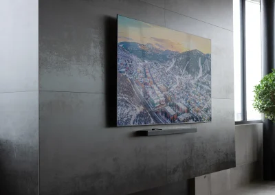 Wall-mounted TV above sleek modern fireplace in minimalist interior